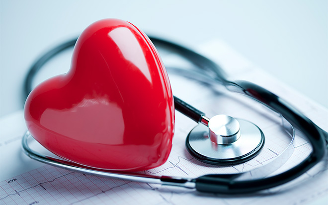 A heart shape on an electrocardiogram with a stethoscope image
