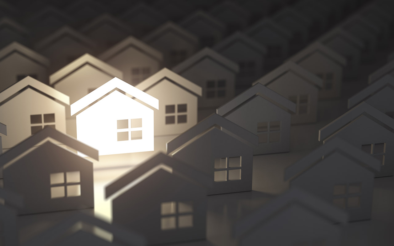 Unique lighting house sign in group of houses. Real estate property industry concept background.