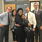 Mother and Daughter hugging and Some Nelson Mullins employees