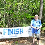 Photo of Nelson Mullins employee at the finish line