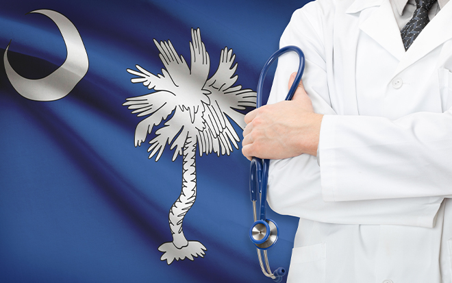 Image of a doctor in front of a flag